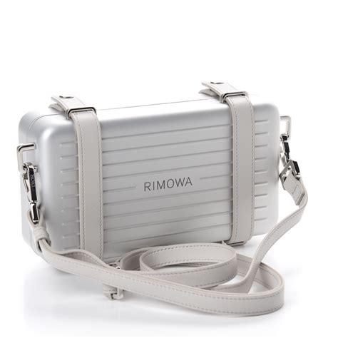 dior clutch rimowa|christian Dior silver strap clutch.